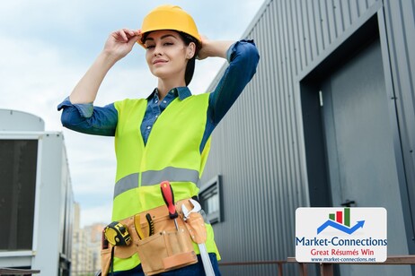 Confident female architect with tool belt in safety vest and helmet. There is also a logo from https://www.market-connections.net - Free Stock Image