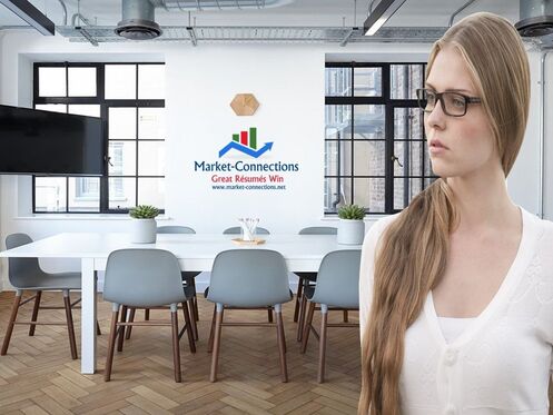 Photo of an office in the backgtound. Photo is by Pexels from Pixabay. There is a lady standing in the front and there is a logo from https://www.market-connections.net