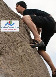 A man is climbing a mountain and ther is a logo of https://www.market-connections.net on the side